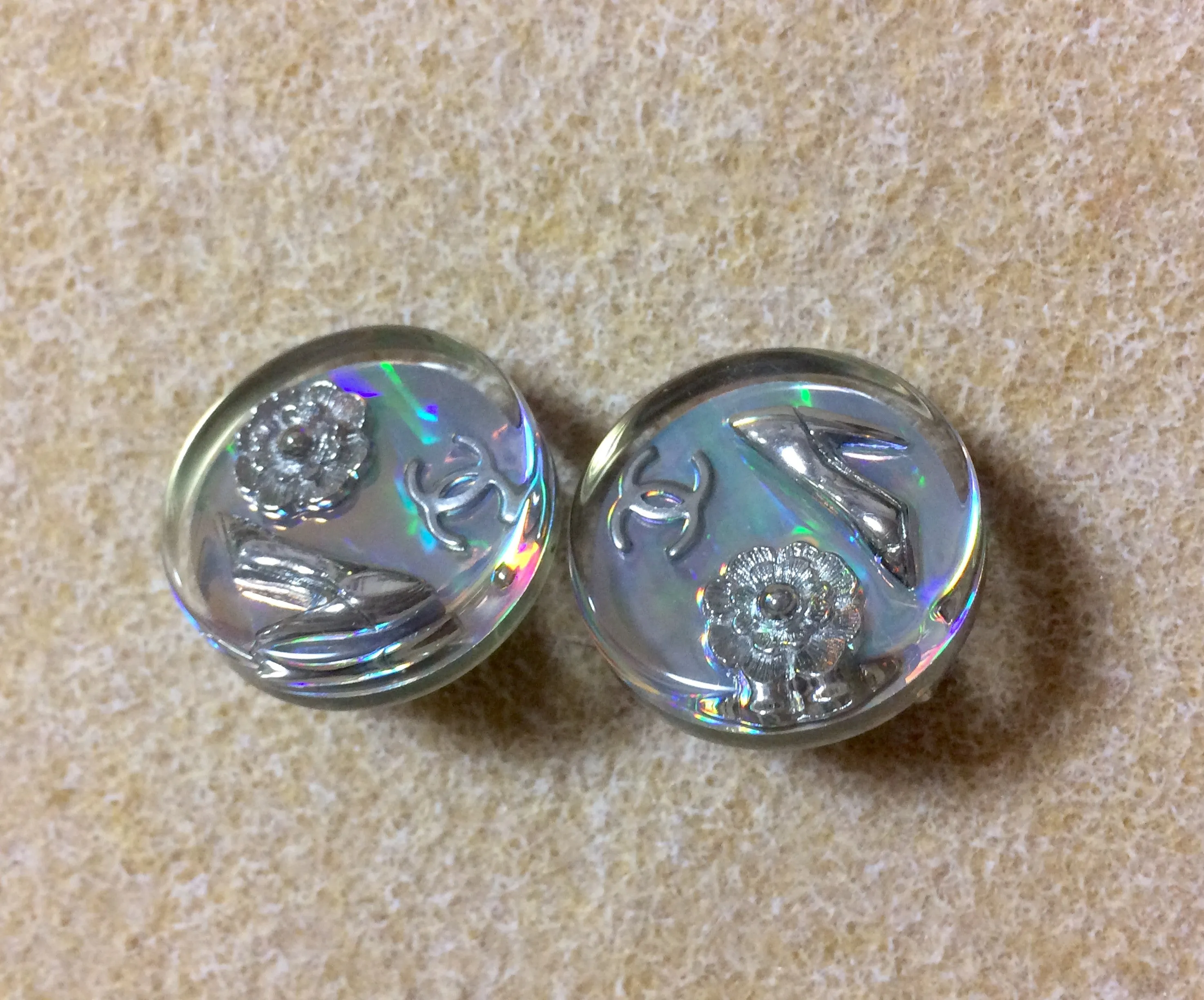 Vintage CHANEL silver tone and rainbow aurora shining earrings with Chanel iconic charms. Shoe, camellia, and CC mark in it. Perfect.
