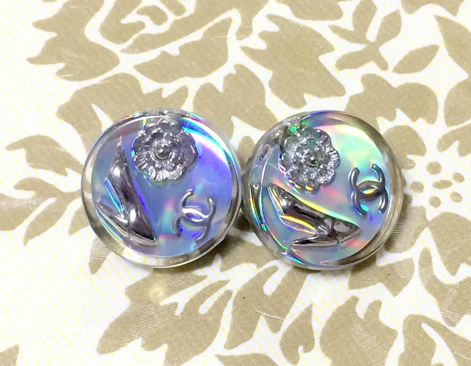 Vintage CHANEL silver tone and rainbow aurora shining earrings with Chanel iconic charms. Shoe, camellia, and CC mark in it. Perfect.