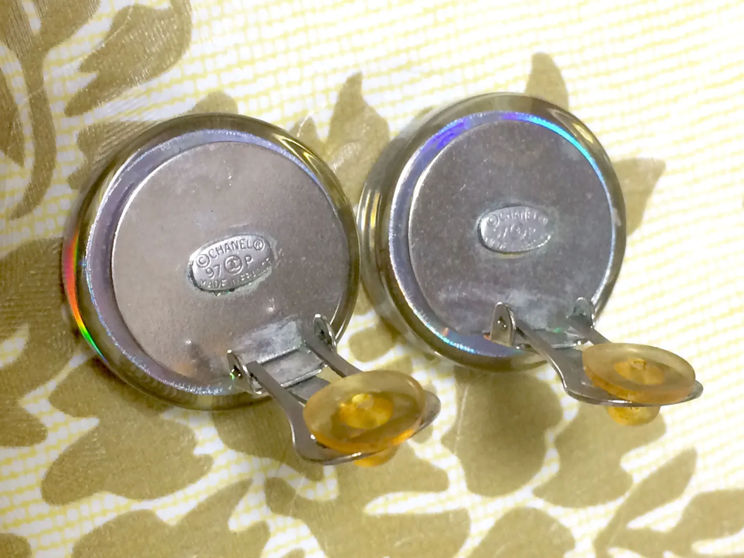 Vintage CHANEL silver tone and rainbow aurora shining earrings with Chanel iconic charms. Shoe, camellia, and CC mark in it. Perfect.