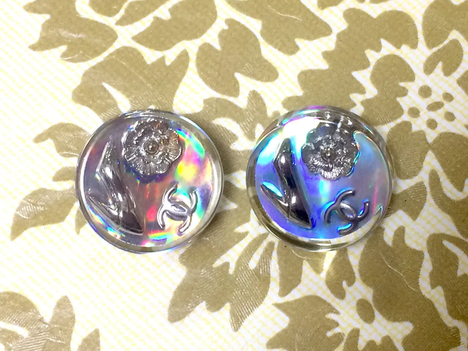 Vintage CHANEL silver tone and rainbow aurora shining earrings with Chanel iconic charms. Shoe, camellia, and CC mark in it. Perfect.